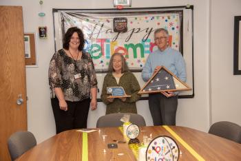 Nebraska State Penitentiary Warden Michele Capps, Ann, and Ann's family.